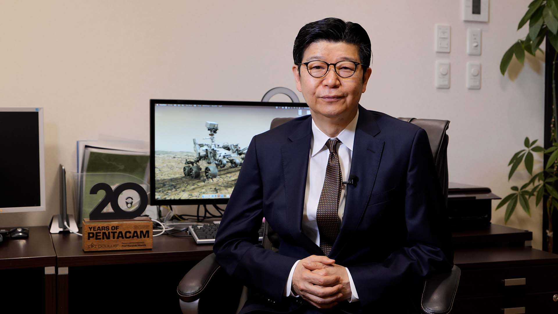Prof Naoyuki Maeda sitting in office