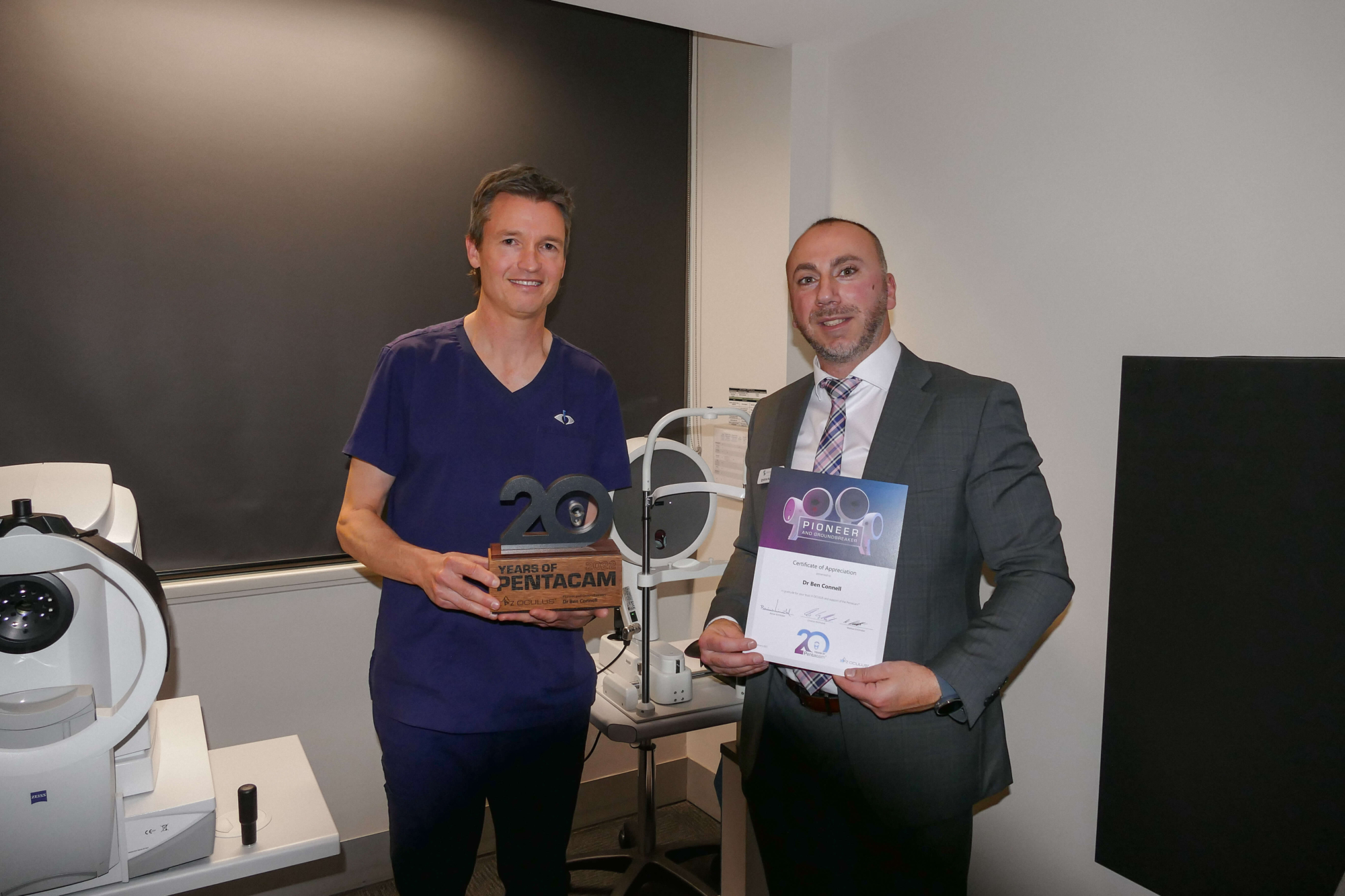 Dr Ben Connell receives the 20th Anniversary Pentacam® Trophy Certificate of Appreciation