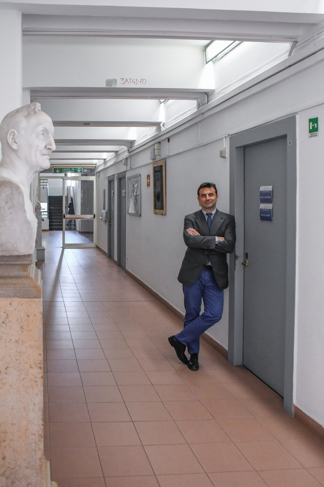 Prof Michele Lanza standing in front of his office